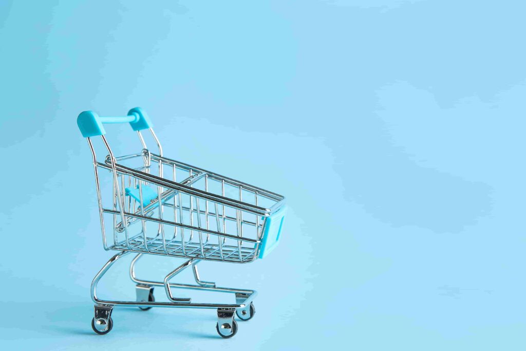 blue shopping cart on light blue background