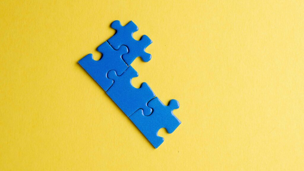blue puzzle piece yellow background